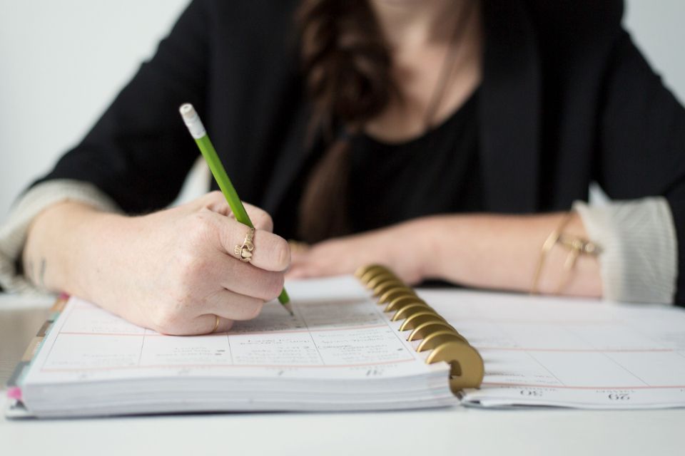 Landlord writing the house rules list for tenants